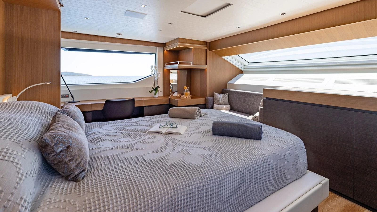 The master stateroom offers a spacious and serene retreat with large windows providing stunning views. aboard JOURNEY Yacht for Sale