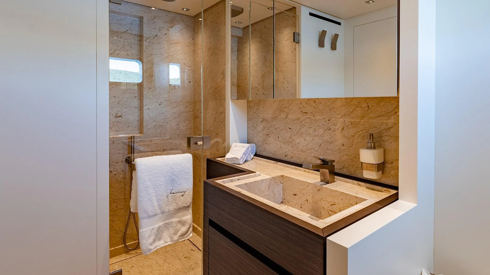 The yacht's bathroom features a sleek design with modern fixtures and luxurious finishes. aboard JOURNEY Yacht for Sale