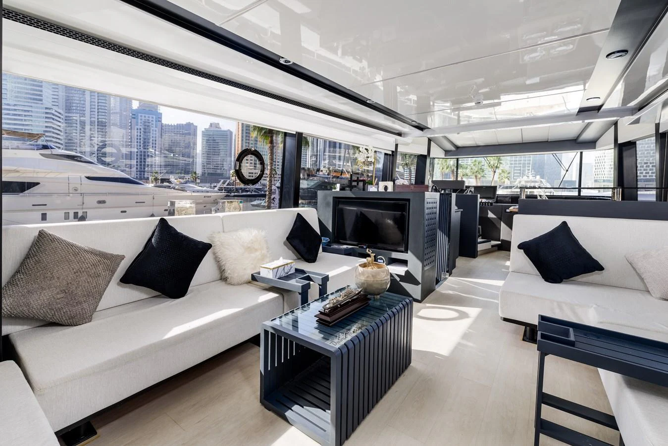 The salon features luxurious seating with a modern, open layout and ample natural light. aboard AL SULTAN Yacht for Sale