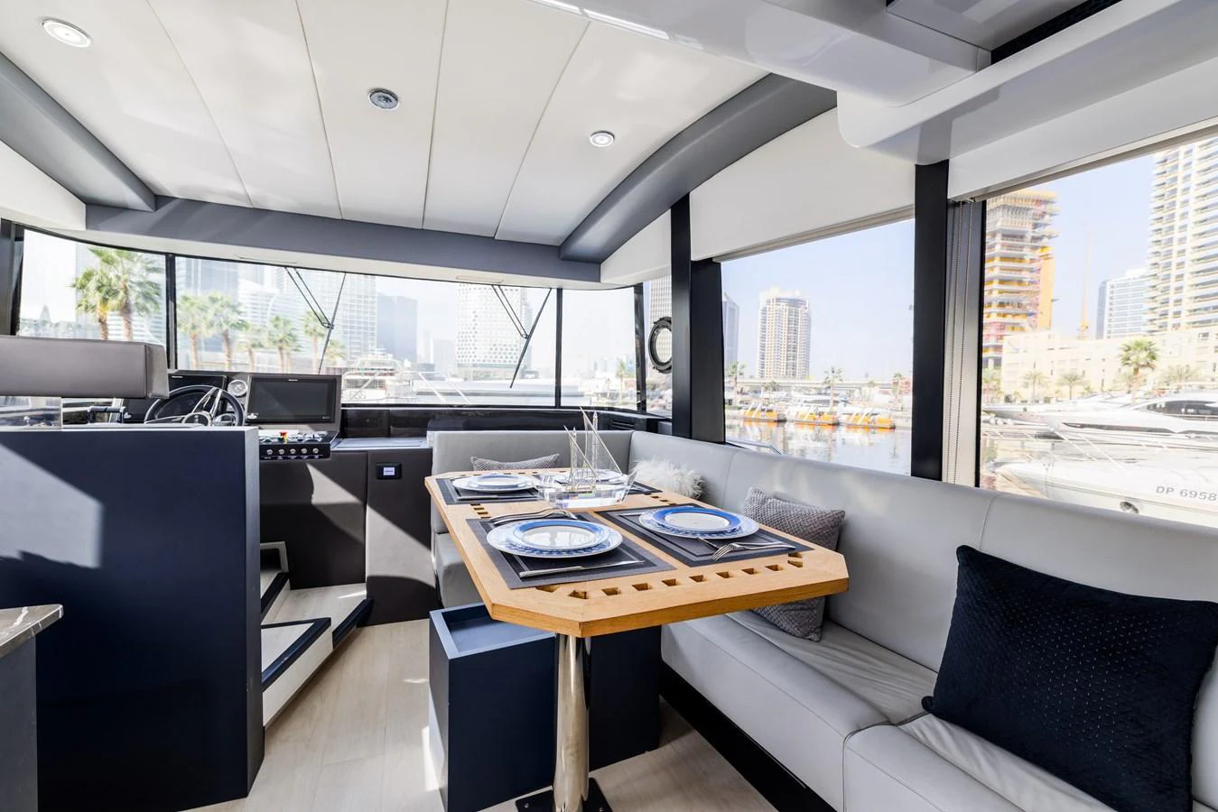 The yacht's dining area features a modern and elegant design with ample natural light. aboard AL SULTAN Yacht for Sale