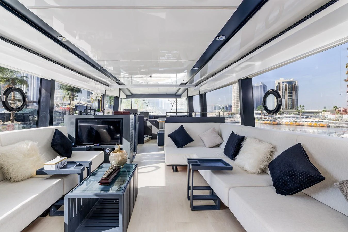 The salon features modern furnishings with ample seating and large windows for panoramic views. aboard AL SULTAN Yacht for Sale