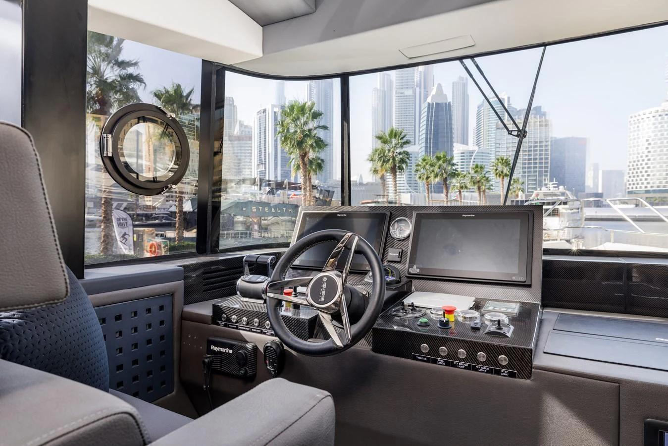 The helm station offers a modern and well-equipped command center with a view of the marina. aboard AL SULTAN Yacht for Sale