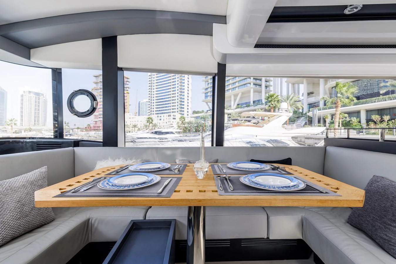 The yacht's dining area offers a stylish and comfortable setting with a view of the marina. aboard AL SULTAN Yacht for Sale