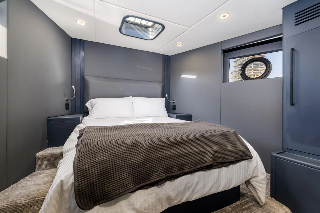 A cozy stateroom with a comfortable bed and modern design. aboard AL SULTAN Yacht for Sale