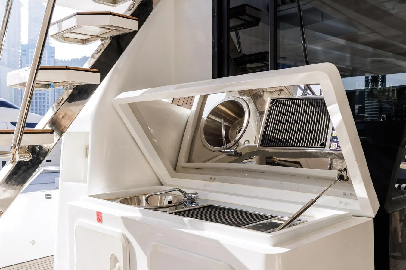 The yacht features a sleek outdoor galley with a sink and grill, perfect for alfresco dining. aboard AL SULTAN Yacht for Sale