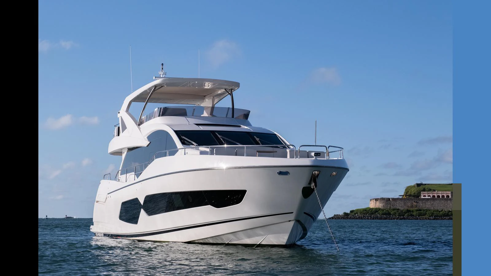 A sleek and modern yacht cruising on calm waters under a clear blue sky. aboard ONLY 1100 HRS! Yacht for Sale