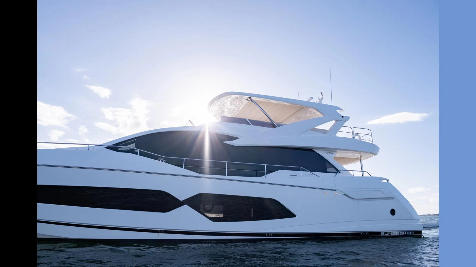 A sleek and modern yacht glides gracefully on the water under a bright sun. aboard ONLY 1100 HRS! Yacht for Sale
