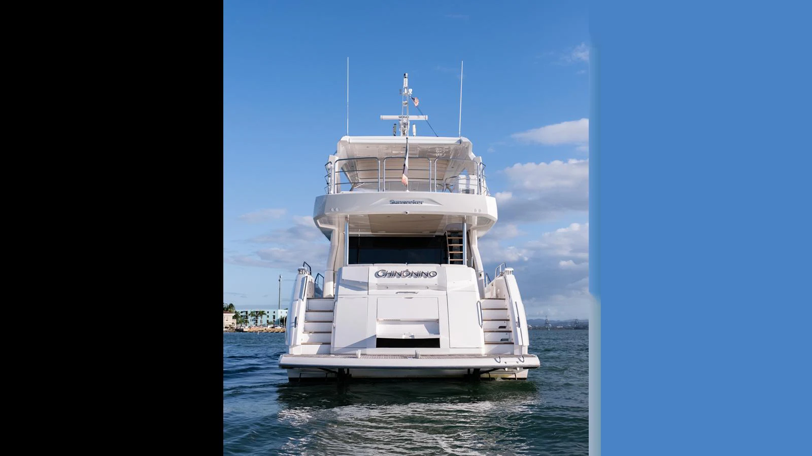A luxurious yacht is seen from the rear, showcasing its elegant design and spacious decks. aboard ONLY 1100 HRS! Yacht for Sale