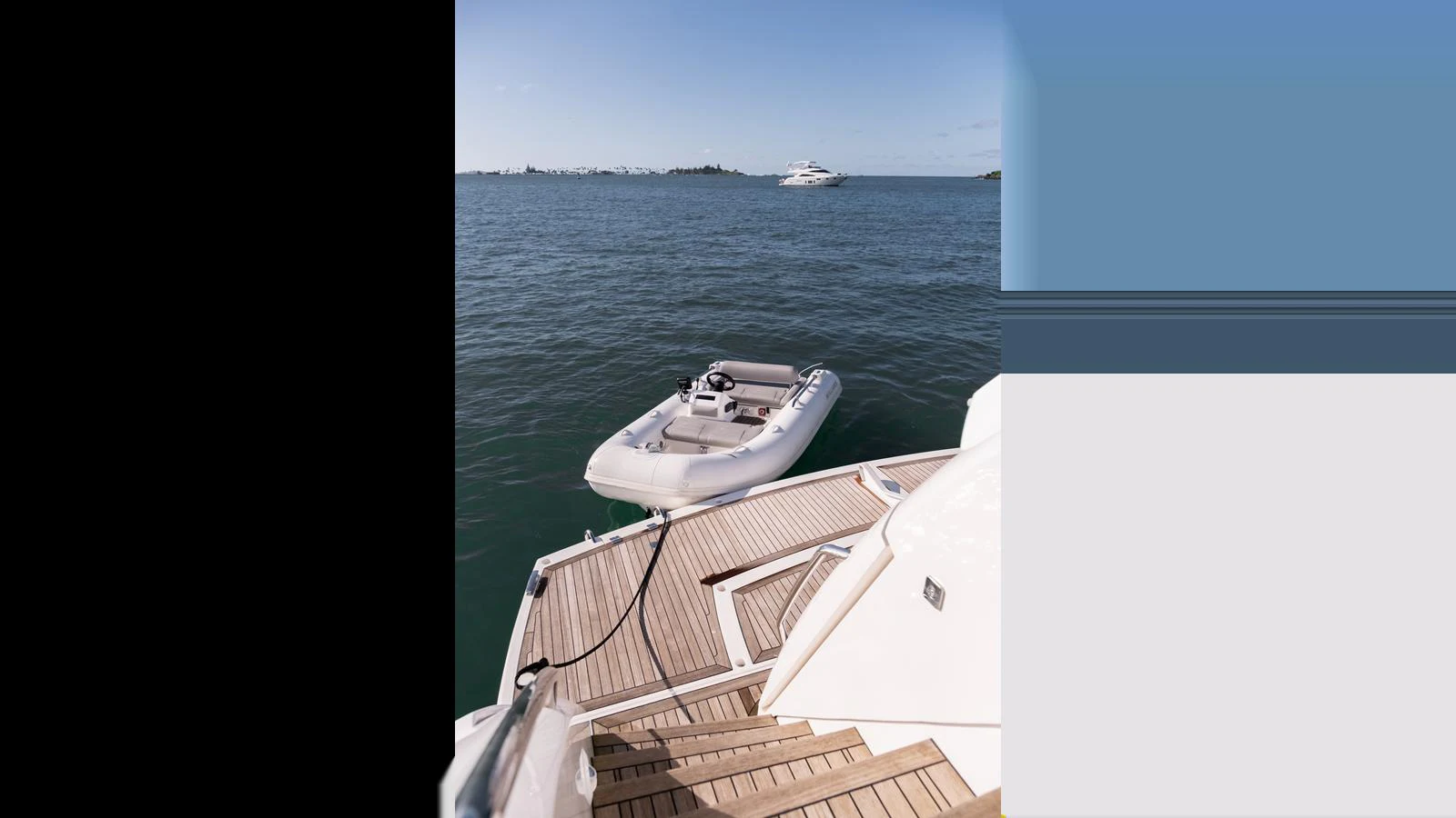 A sleek tender is moored at the aft deck of a yacht, ready for excursions. aboard ONLY 1100 HRS! Yacht for Sale