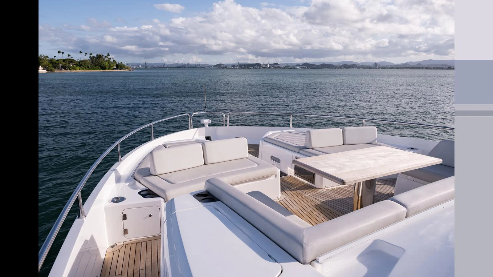 The foredeck offers a luxurious seating area with a table, perfect for enjoying the scenic views. aboard ONLY 1100 HRS! Yacht for Sale