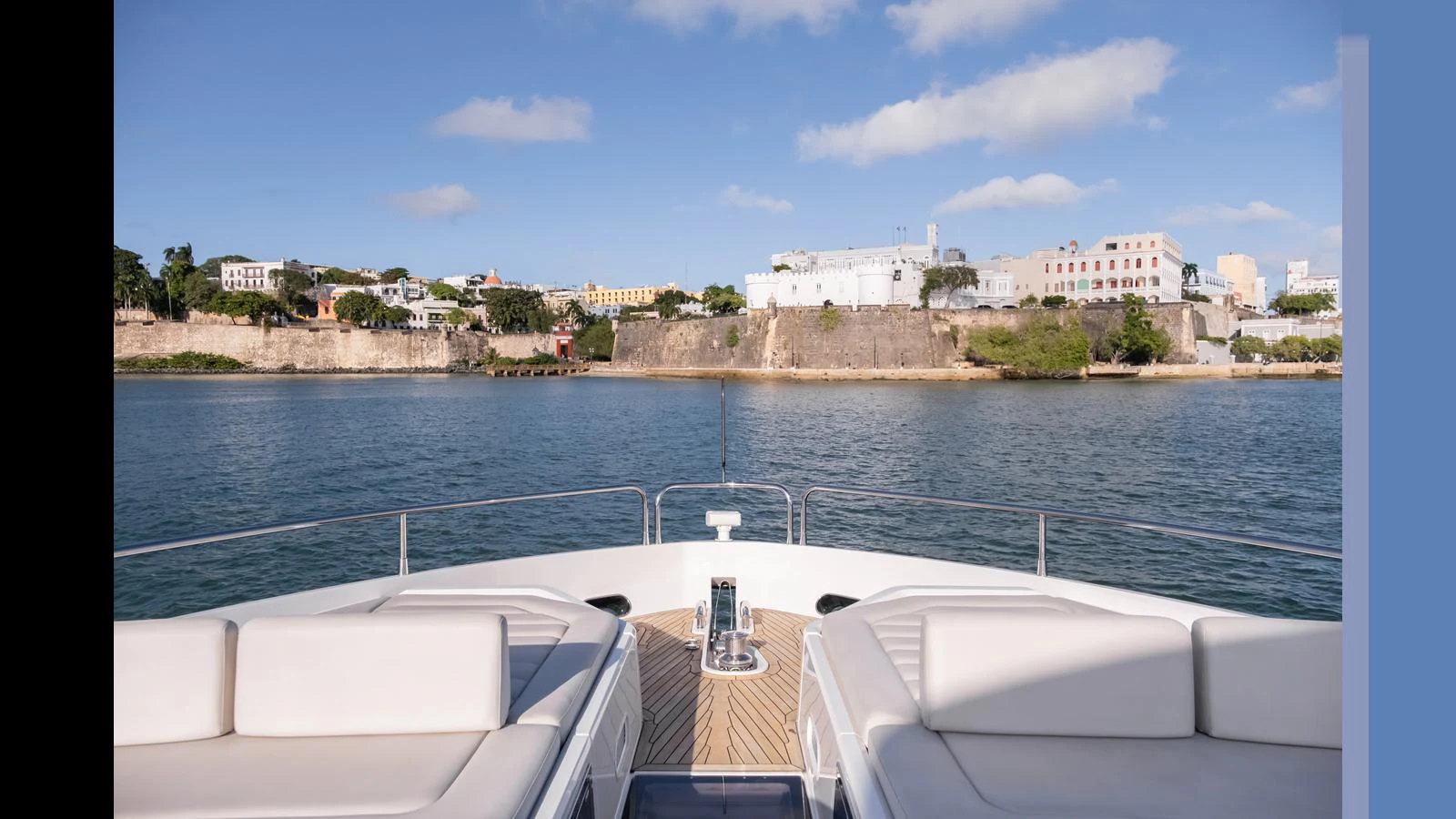 The yacht's bow offers a serene view of the coastline, perfect for relaxation. aboard ONLY 1100 HRS! Yacht for Sale