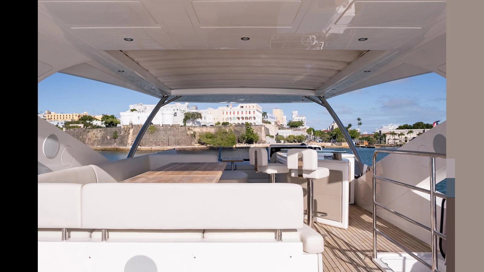 The flybridge offers a spacious and inviting area with comfortable seating and a dining table, perfect for enjoying scenic views. aboard ONLY 1100 HRS! Yacht for Sale