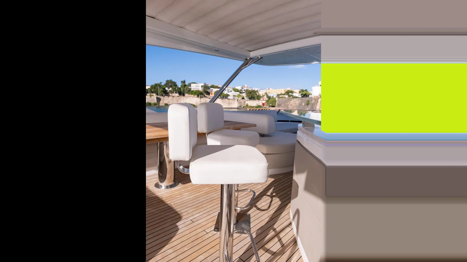 The flybridge offers a stylish and comfortable seating area with a scenic view. aboard ONLY 1100 HRS! Yacht for Sale