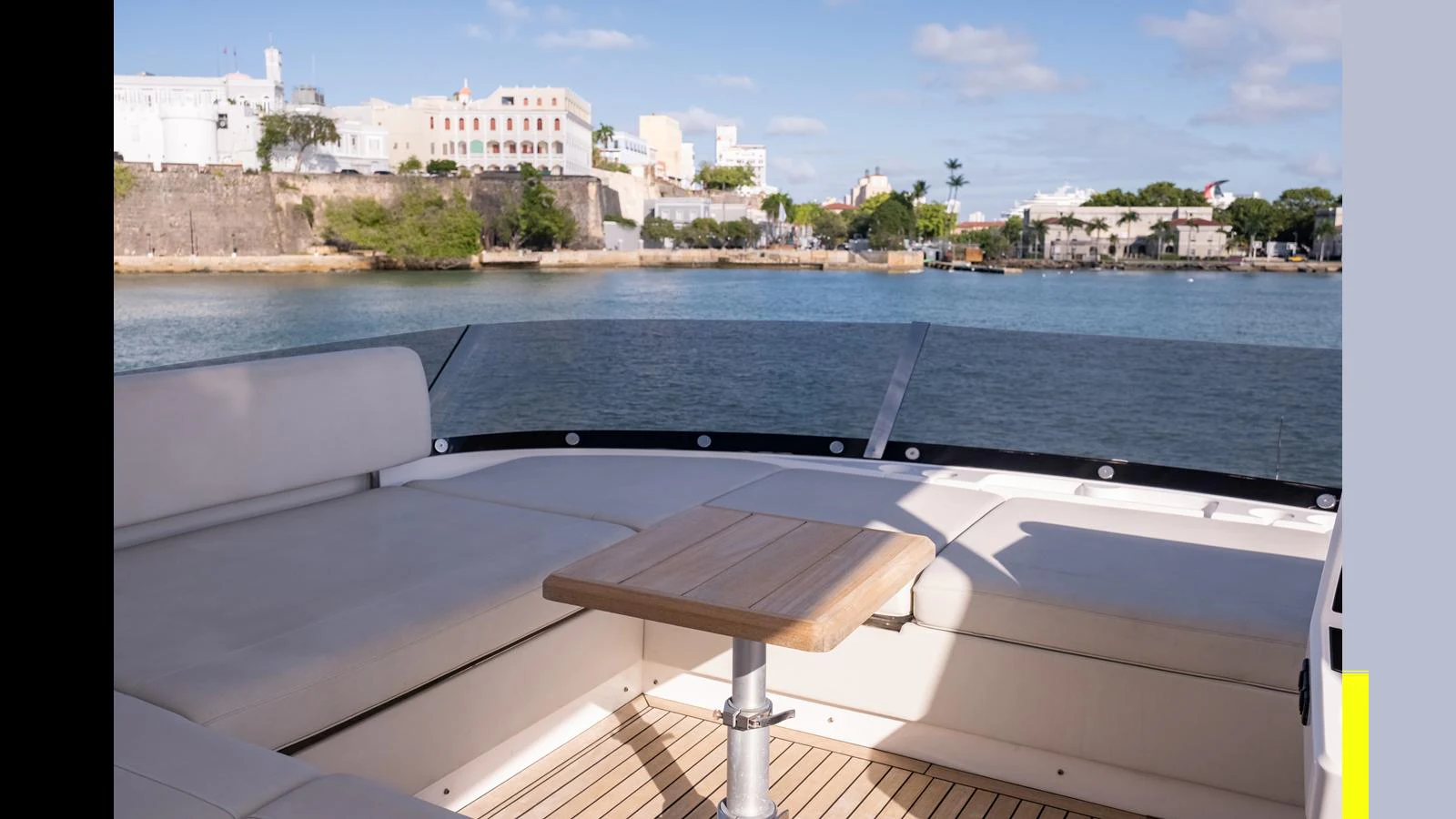 The aft deck offers a serene seating area with a beautiful view of the surrounding waters and coastal architecture. aboard ONLY 1100 HRS! Yacht for Sale