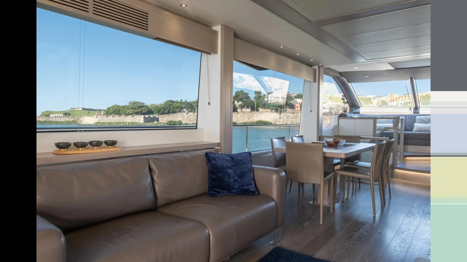 The salon offers a spacious and comfortable seating area with large windows providing stunning views. aboard ONLY 1100 HRS! Yacht for Sale