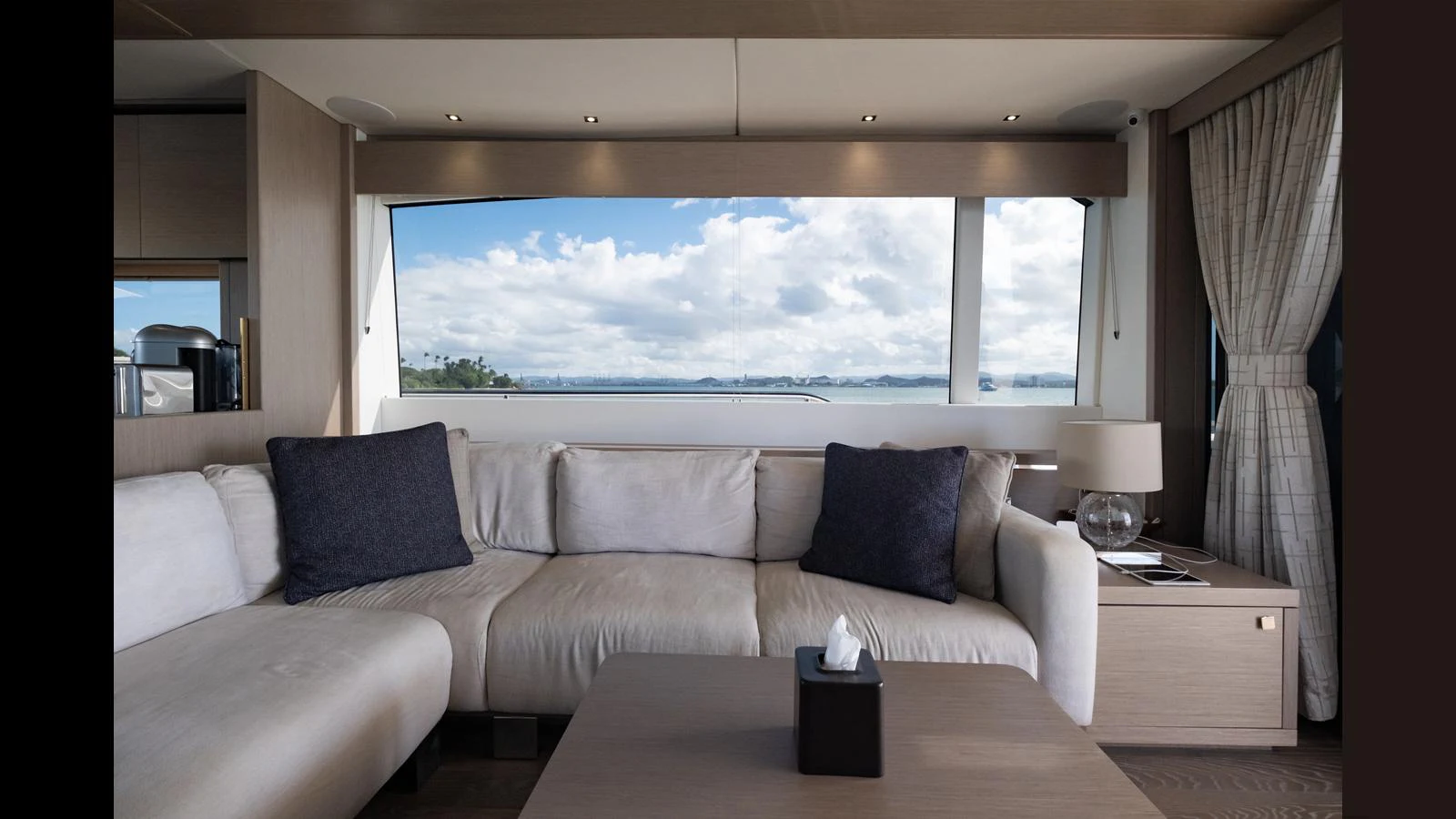 The salon offers a cozy seating area with a stunning view through large windows. aboard ONLY 1100 HRS! Yacht for Sale