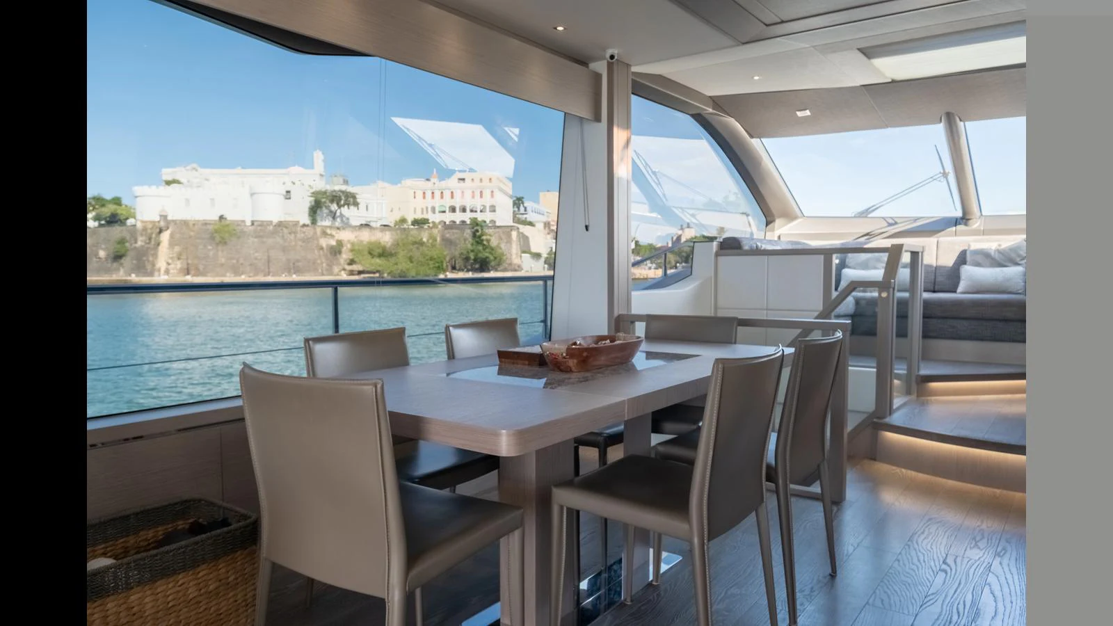 The yacht's dining area offers a spacious and elegant setting with panoramic views. aboard ONLY 1100 HRS! Yacht for Sale