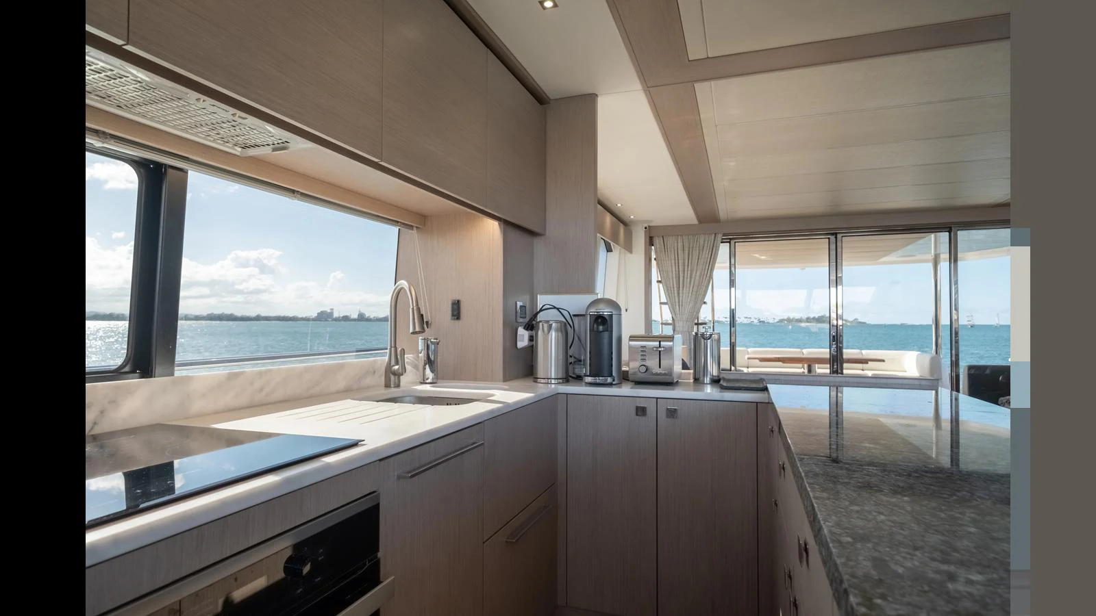 The yacht's galley features modern appliances and a spacious layout with stunning sea views. aboard ONLY 1100 HRS! Yacht for Sale