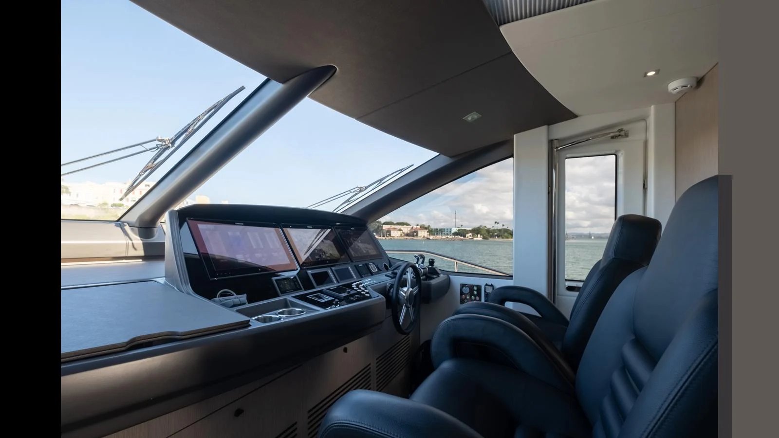 The helm station features modern controls and comfortable seating with a panoramic view. aboard ONLY 1100 HRS! Yacht for Sale