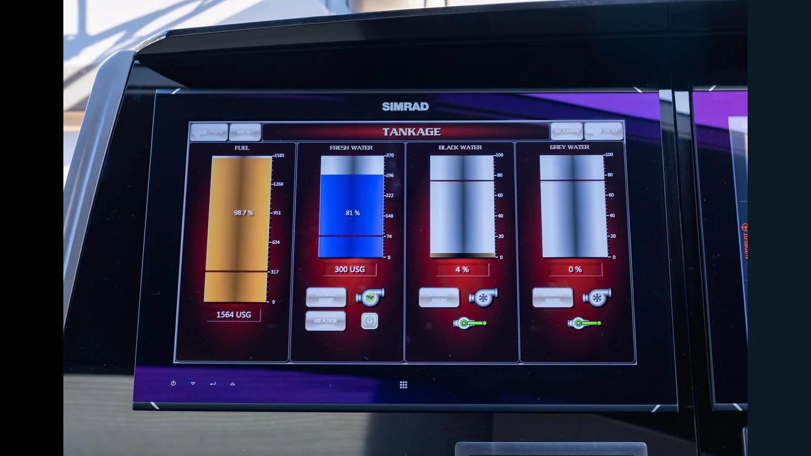 The image shows a close-up of a Simrad tankage monitoring system on a yacht. aboard ONLY 1100 HRS! Yacht for Sale