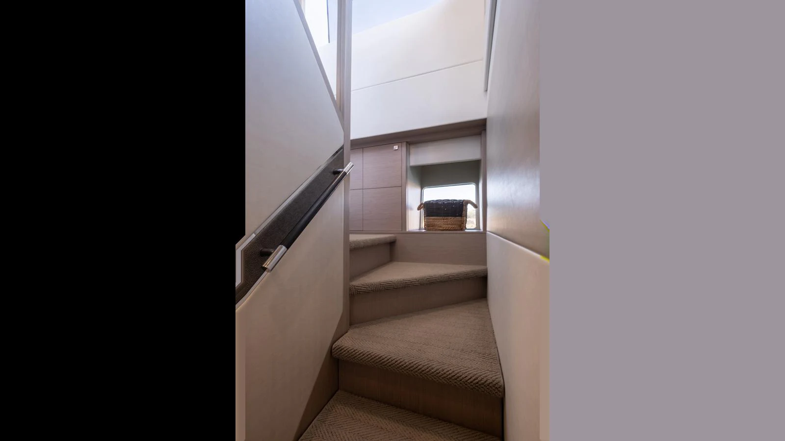 A staircase leads to a cozy and inviting interior space on the yacht. aboard ONLY 1100 HRS! Yacht for Sale
