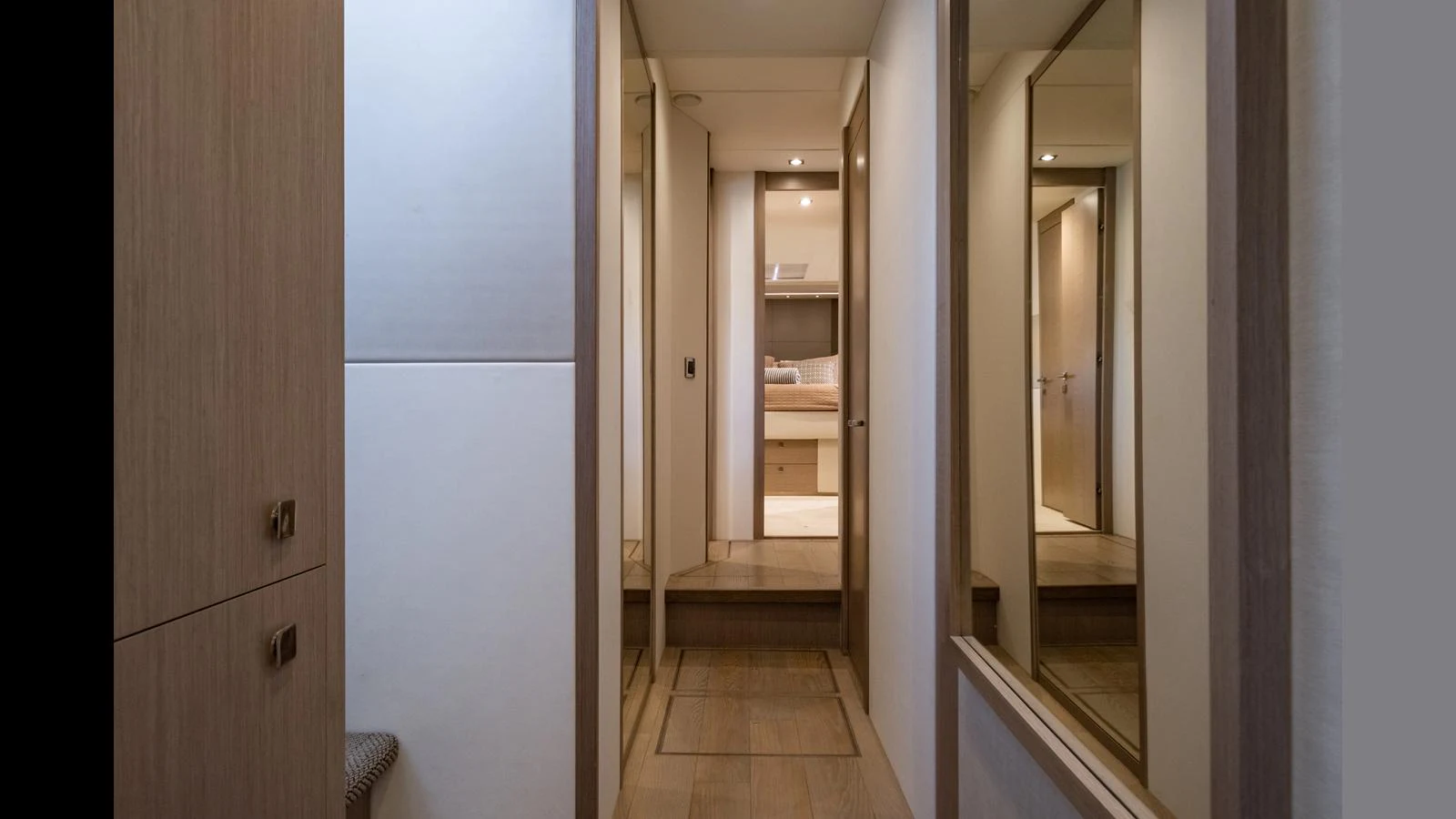 A sleek and modern hallway leading to a cozy stateroom. aboard ONLY 1100 HRS! Yacht for Sale