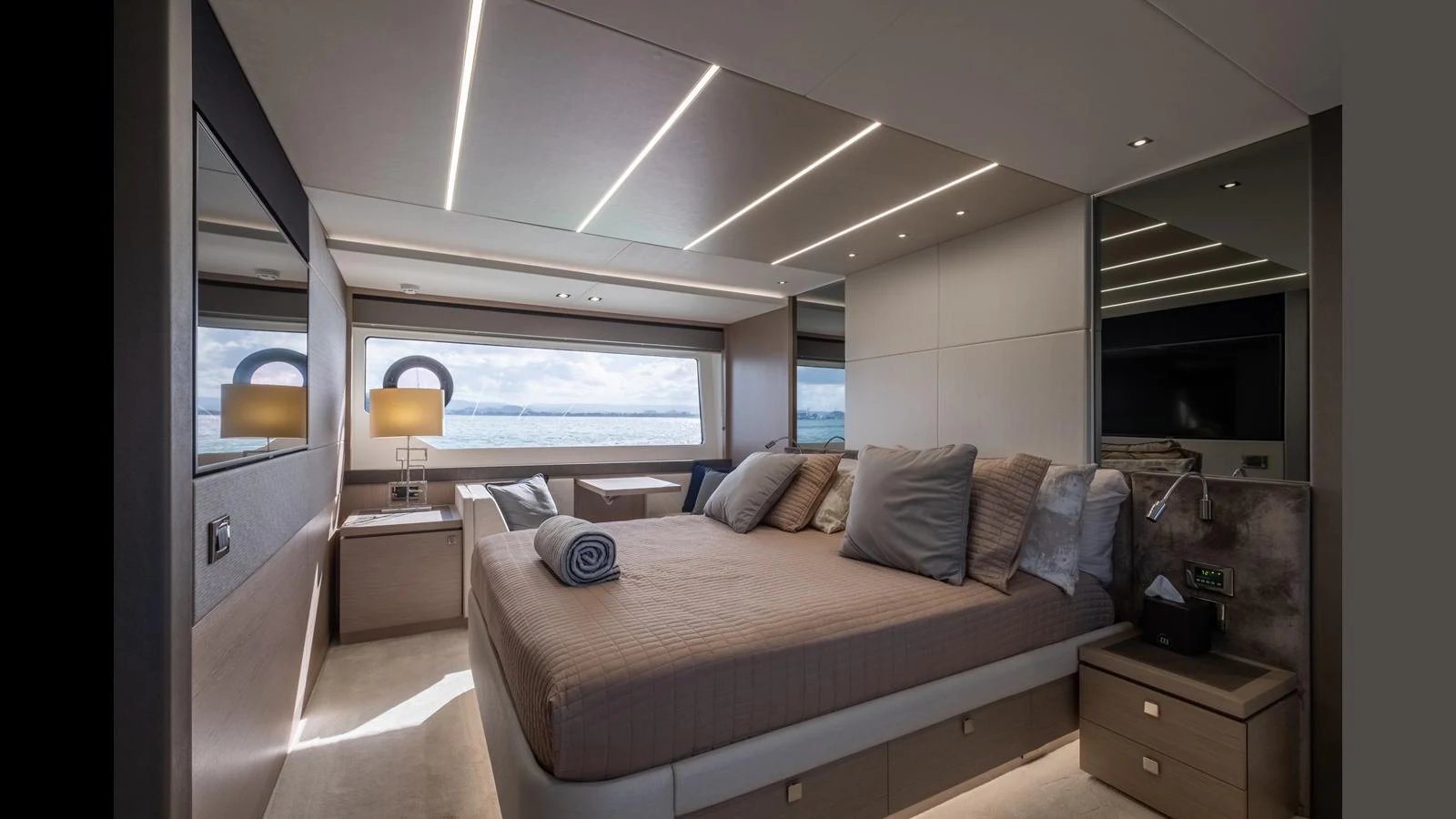 A luxurious stateroom with a large bed, modern lighting, and expansive windows offering stunning sea views. aboard ONLY 1100 HRS! Yacht for Sale