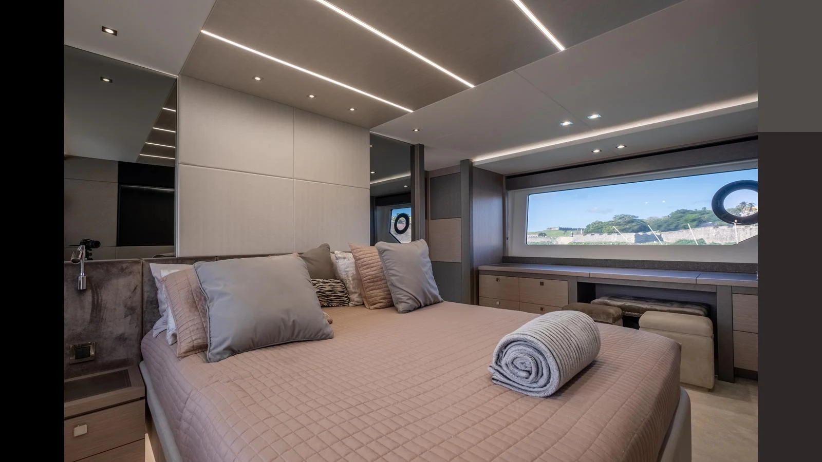 The master stateroom features a spacious bed with elegant bedding and ample natural light from large windows. aboard ONLY 1100 HRS! Yacht for Sale