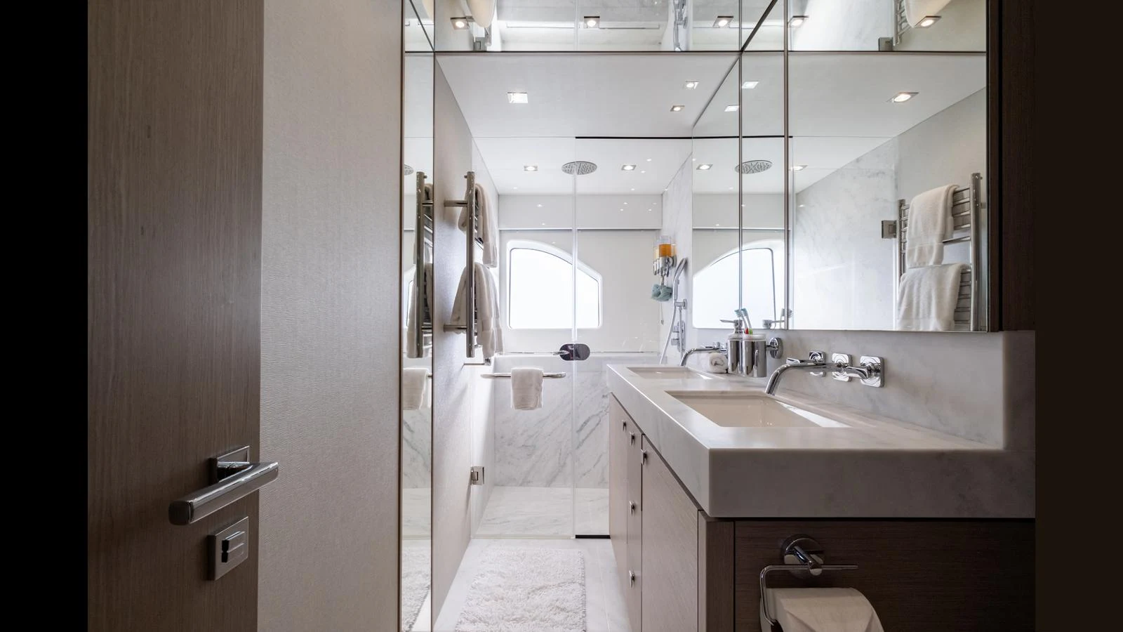 The yacht's bathroom features a sleek, modern design with a spacious shower and elegant fixtures. aboard ONLY 1100 HRS! Yacht for Sale