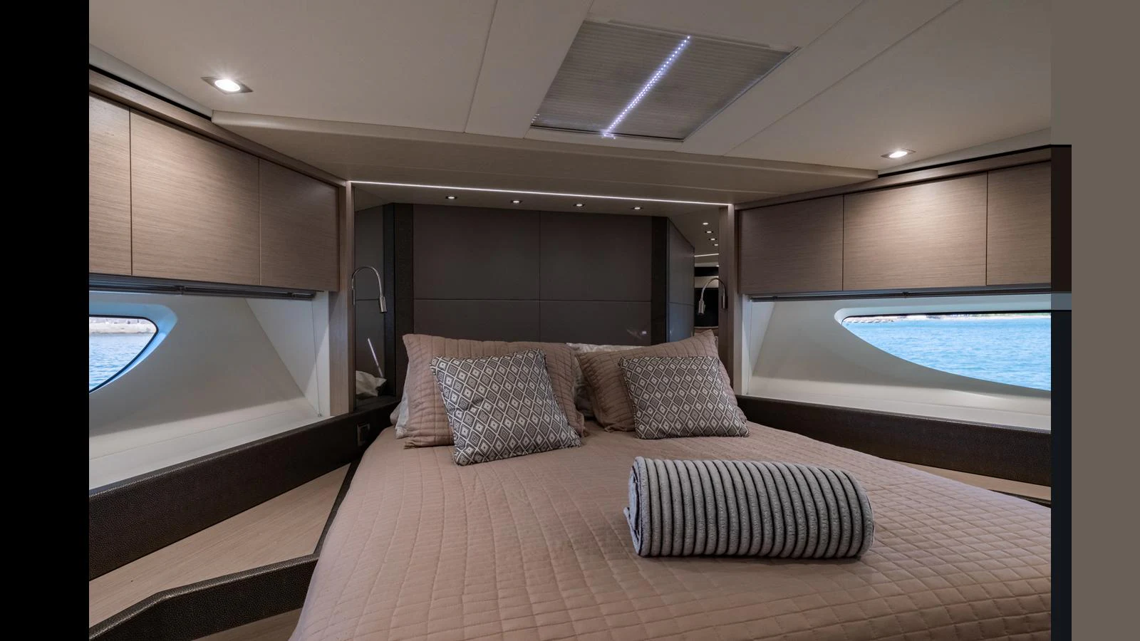The stateroom features a plush bed with elegant bedding and ample natural light from the large windows. aboard ONLY 1100 HRS! Yacht for Sale