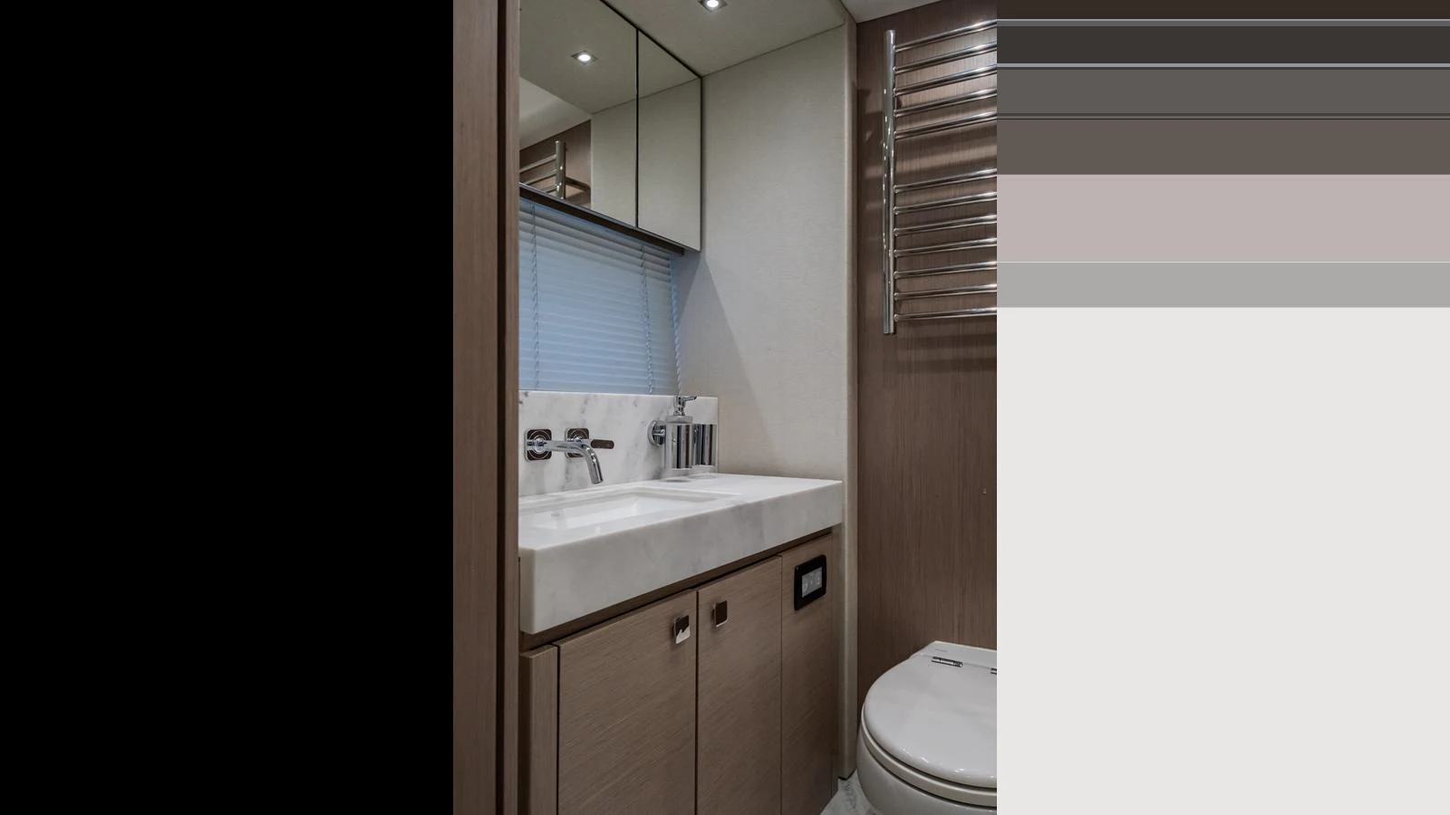 A modern yacht bathroom with sleek fixtures and a minimalist design. aboard ONLY 1100 HRS! Yacht for Sale