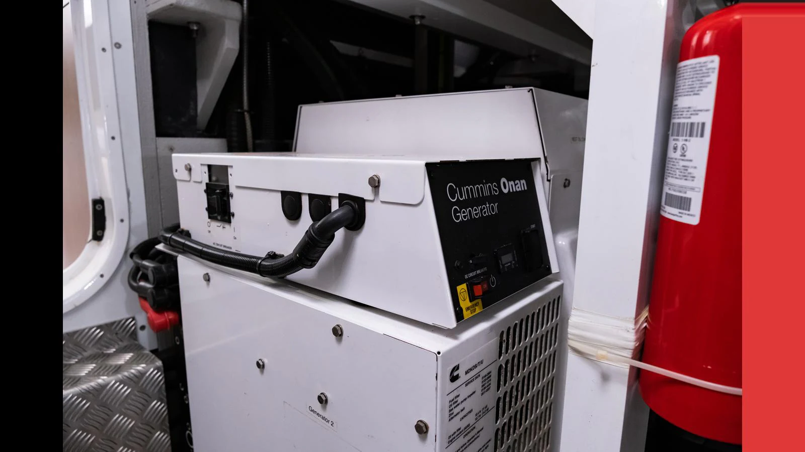 The image showcases a Cummins Onan generator installed in the yacht's technical area. aboard ONLY 1100 HRS! Yacht for Sale