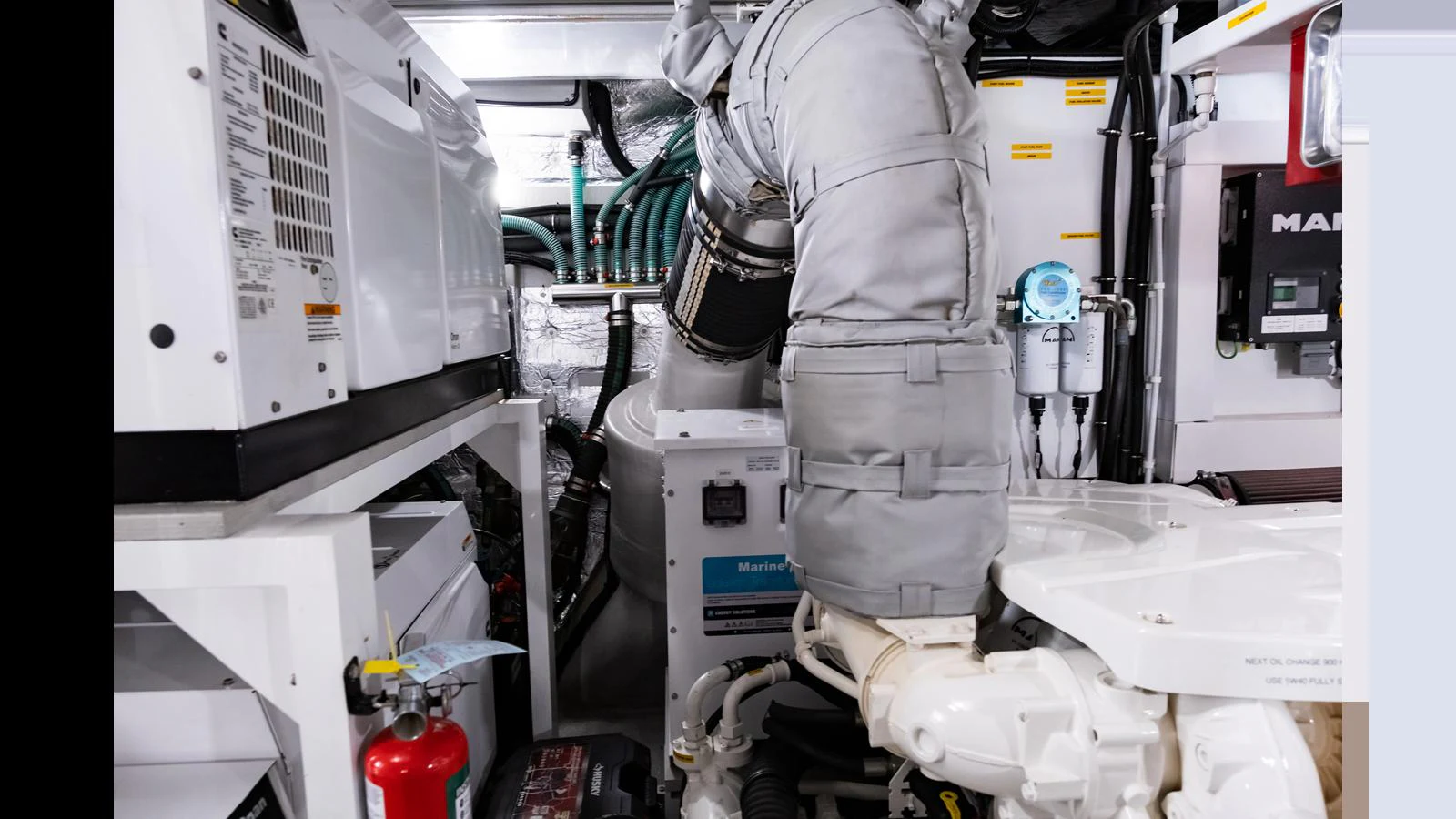 The image showcases the well-maintained engine room of the yacht, highlighting its advanced machinery and equipment. aboard ONLY 1100 HRS! Yacht for Sale