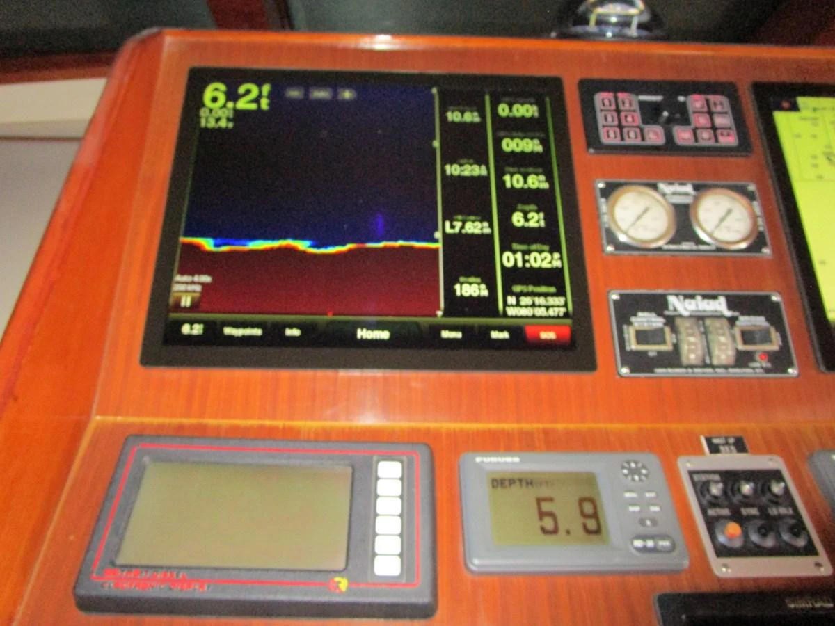 The helm features advanced navigation and monitoring equipment for precise control. aboard SHEPSL X Yacht for Sale