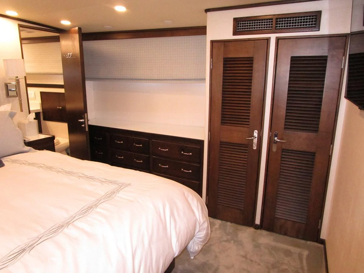A cozy stateroom featuring a comfortable bed and ample storage space. aboard SHEPSL X Yacht for Sale