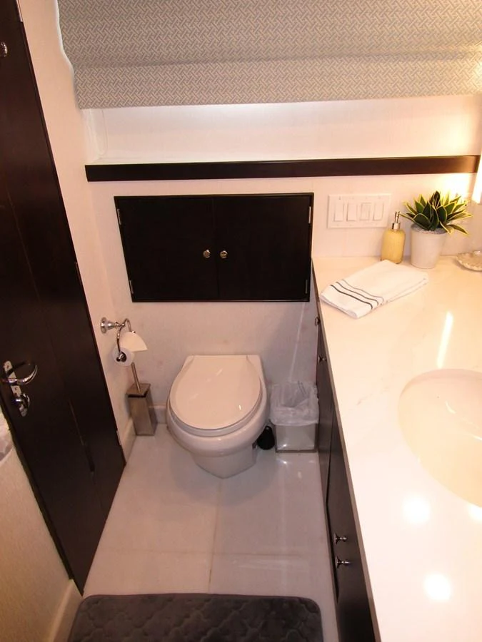 A compact and modern yacht bathroom with sleek fixtures and a clean design. aboard SHEPSL X Yacht for Sale