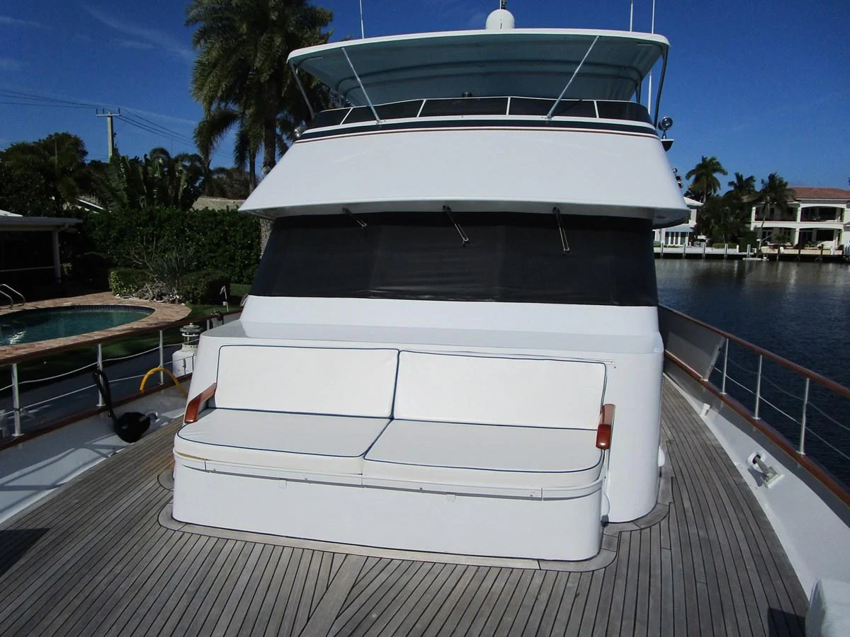 The foredeck features a spacious seating area with a view of the surrounding water and landscape. aboard SHEPSL X Yacht for Sale