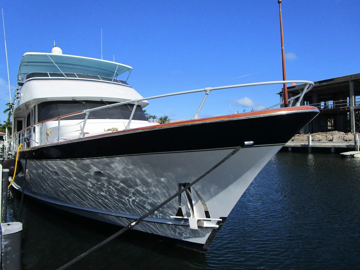 A sleek yacht docked at the marina, showcasing its elegant lines and modern design. aboard SHEPSL X Yacht for Sale