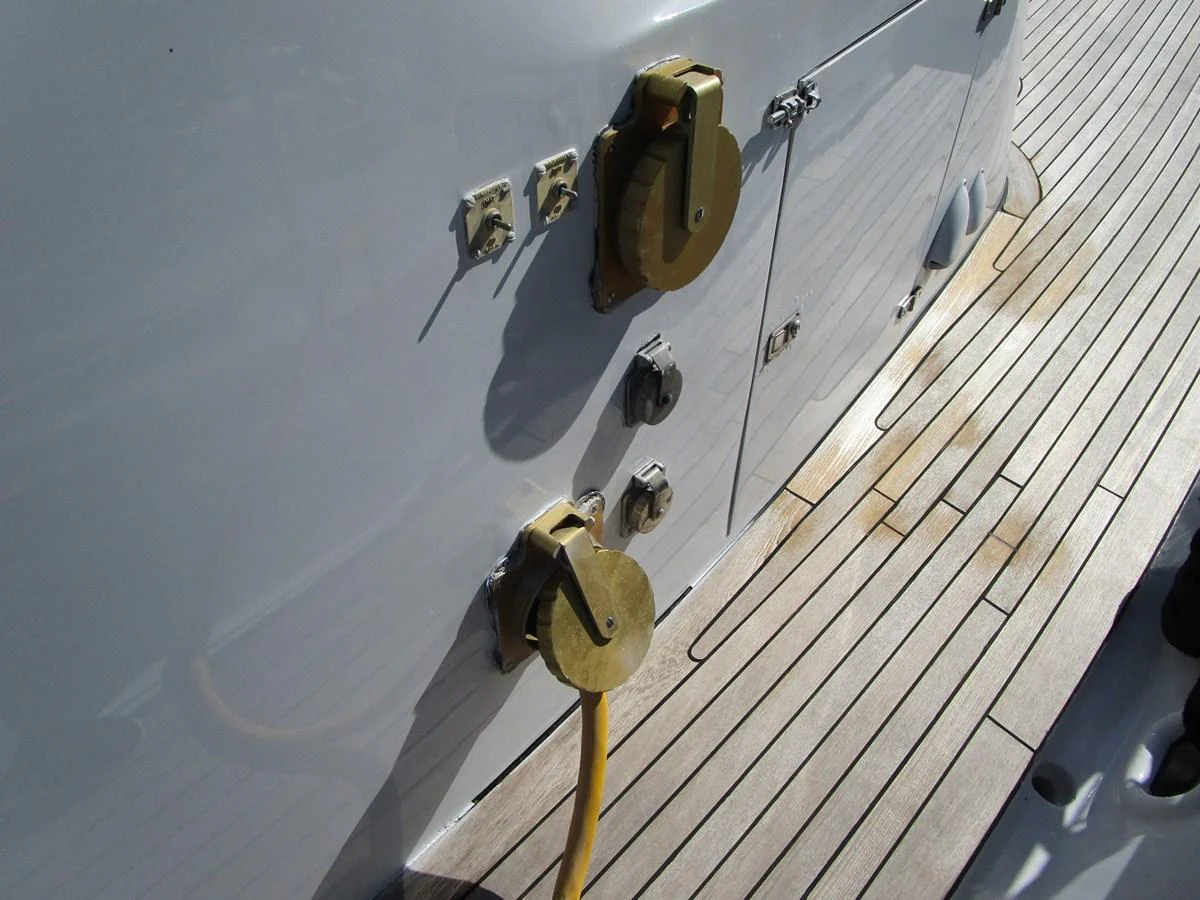 A detailed view of the yacht's deck showcasing utility connections and fittings. aboard SHEPSL X Yacht for Sale