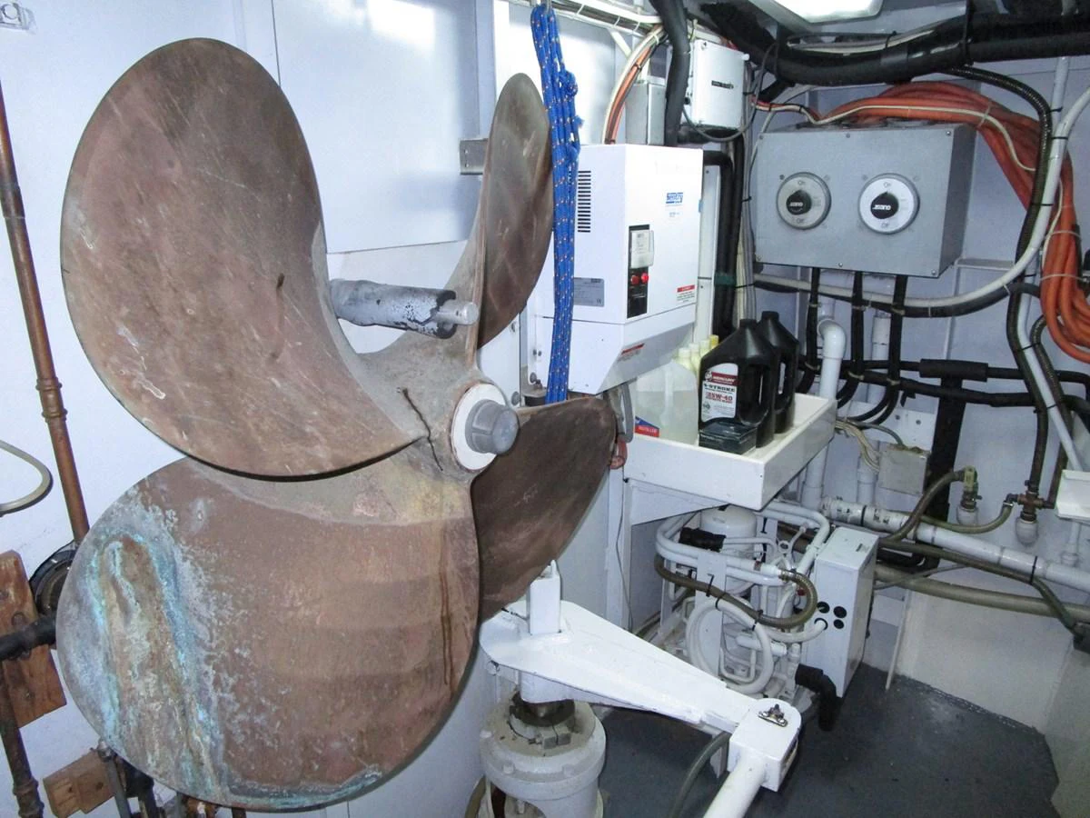 The image showcases the yacht's engine room with a focus on the propeller and mechanical equipment. aboard SHEPSL X Yacht for Sale