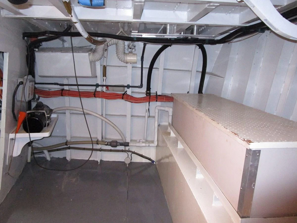 A view of the yacht's technical area showcasing wiring and equipment. aboard SHEPSL X Yacht for Sale