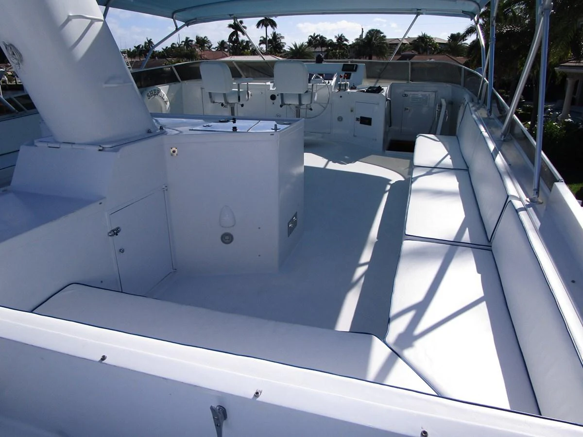 The flybridge offers a spacious and shaded area for relaxation and navigation. aboard SHEPSL X Yacht for Sale