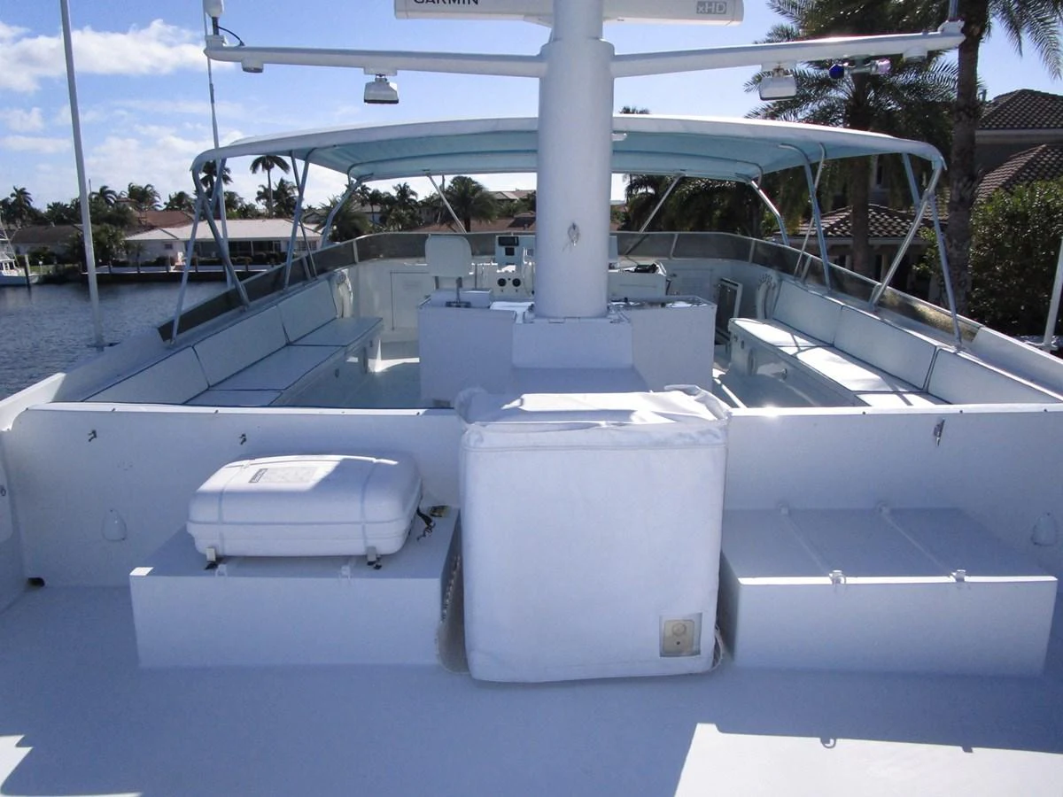The flybridge offers ample seating and a shaded area for relaxation. aboard SHEPSL X Yacht for Sale