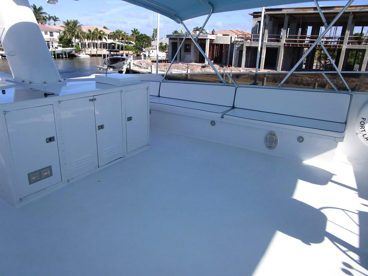 The flybridge offers a spacious and shaded area for relaxation with ample seating and storage. aboard SHEPSL X Yacht for Sale