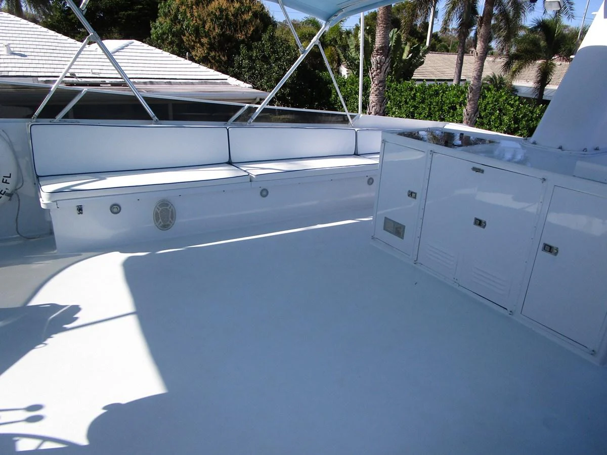 The flybridge features ample seating and storage, perfect for outdoor relaxation. aboard SHEPSL X Yacht for Sale