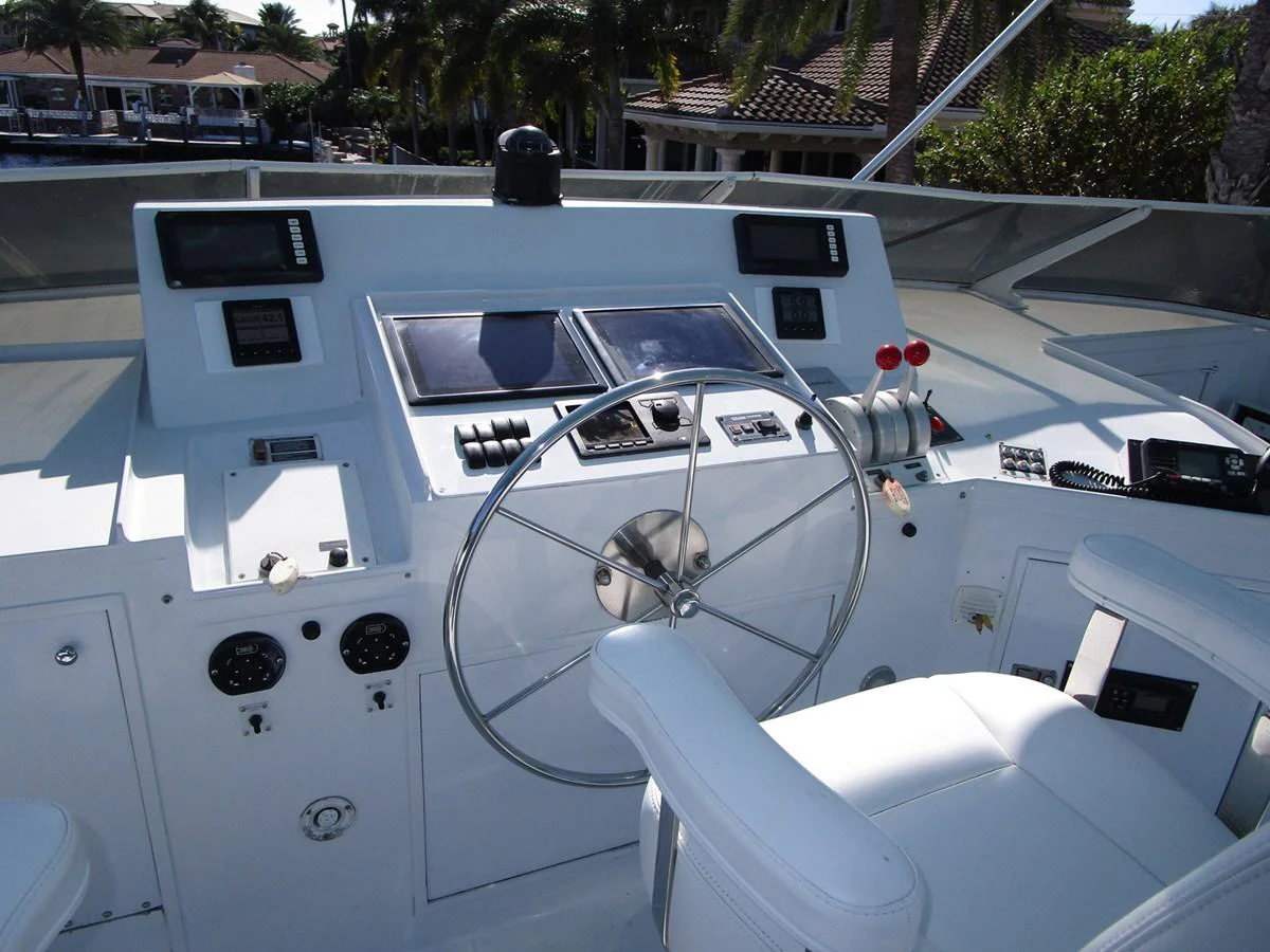 The helm station features modern navigation equipment and comfortable seating. aboard SHEPSL X Yacht for Sale