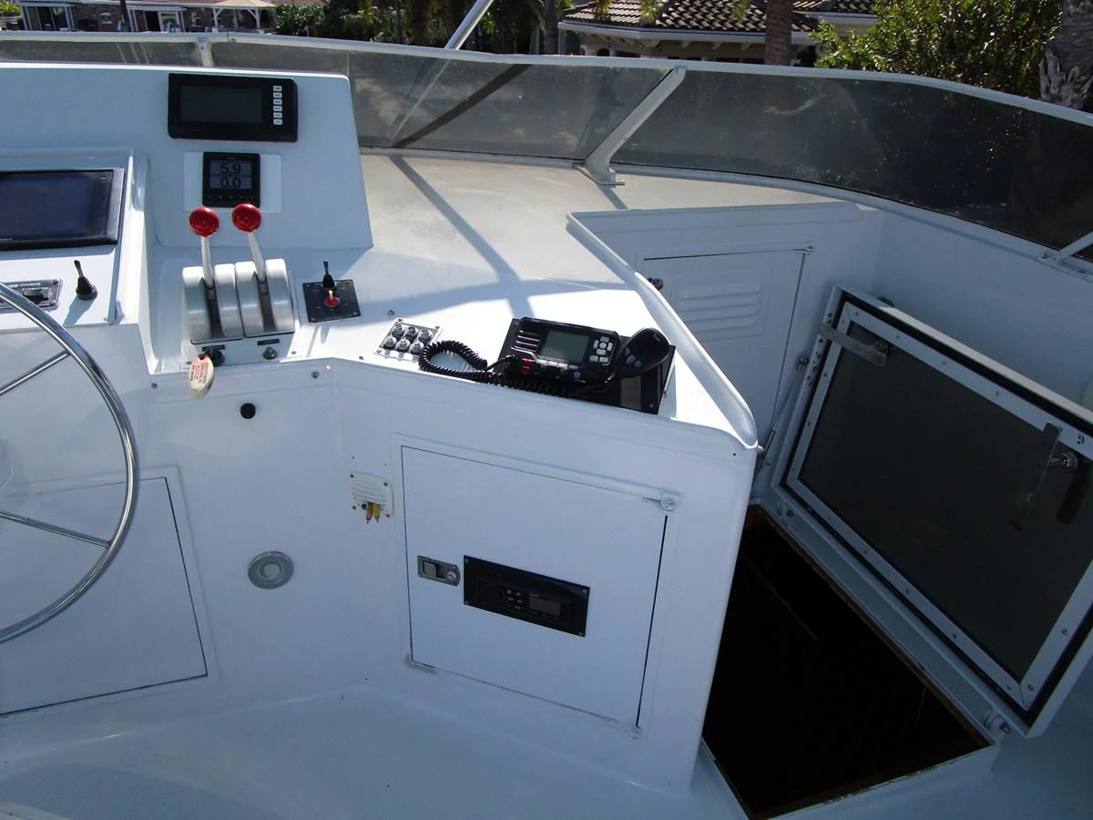 The helm station features essential navigation and control equipment for smooth sailing. aboard SHEPSL X Yacht for Sale