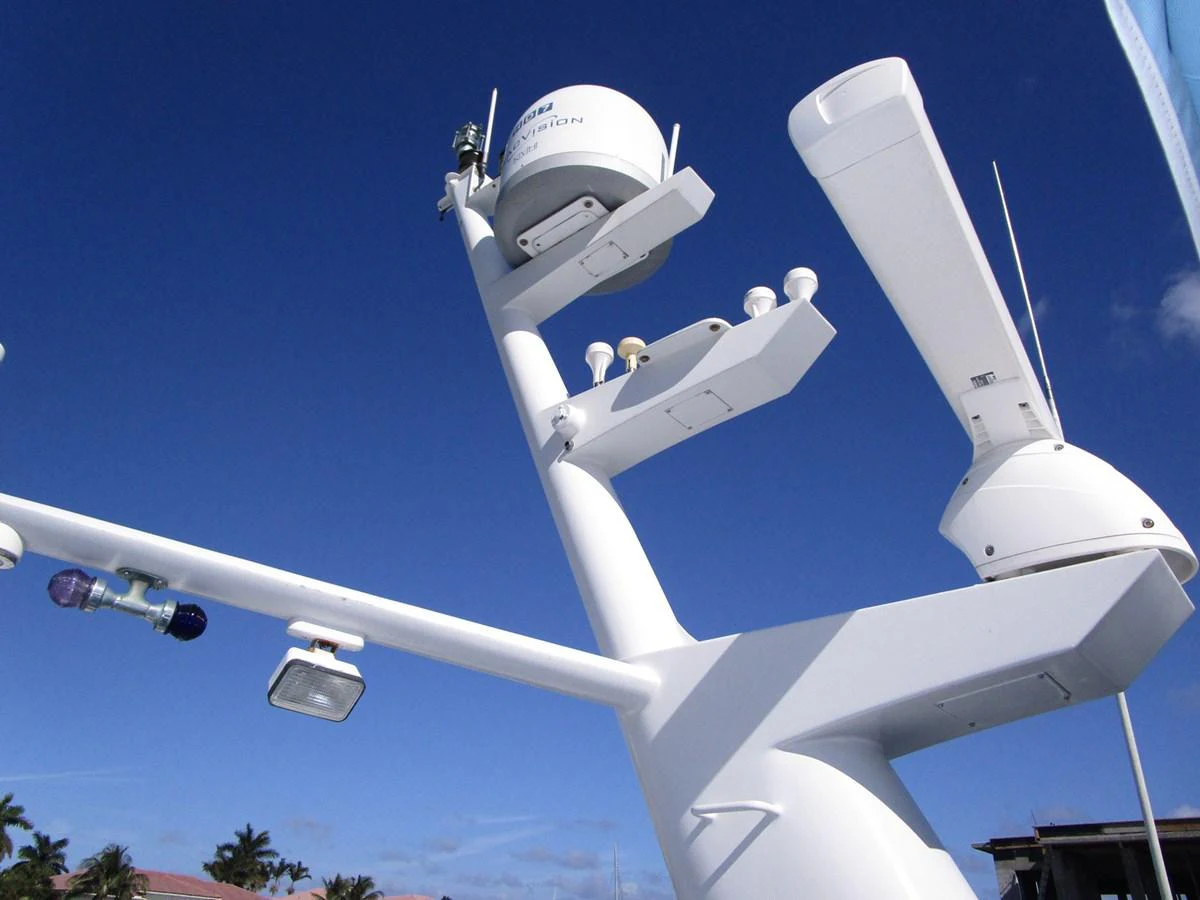A close-up view of the yacht's radar and communication equipment against a clear blue sky. aboard SHEPSL X Yacht for Sale