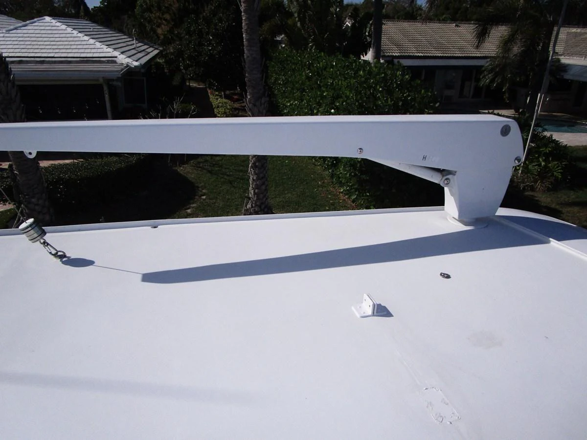 A close-up view of a yacht's deck with a davit crane arm. aboard SHEPSL X Yacht for Sale