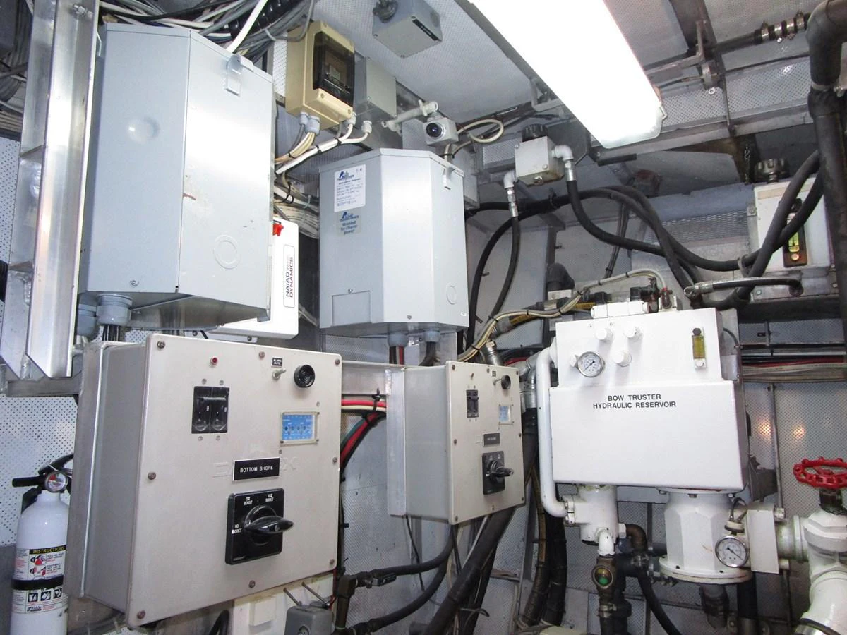 The image showcases the technical and mechanical components within the yacht's engine room. aboard SHEPSL X Yacht for Sale